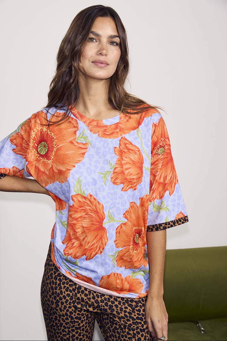 Blue Poppy Print Jersey Pyjamas featuring oversized orange poppies and leopard print accents in a soft stretch jersey.