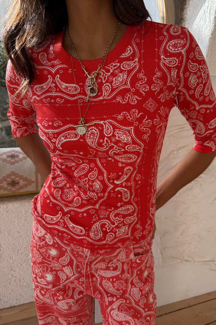 Red Bandana Rib Jersey Top featuring a white paisley print, styled with layered gold necklaces.