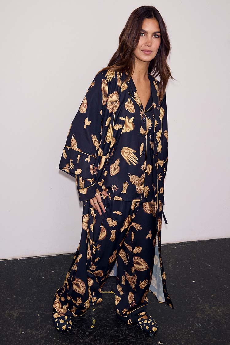 Deloris Satin Robe in black with iconic gold motifs, styled with matching pyjamas and slippers for a full nightwear set.