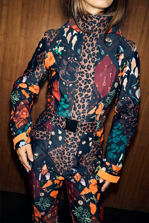 Night Garden Ski Suit featuring a patchwork of leopard, poppy and bandana motifs with a belted waist and high neck.