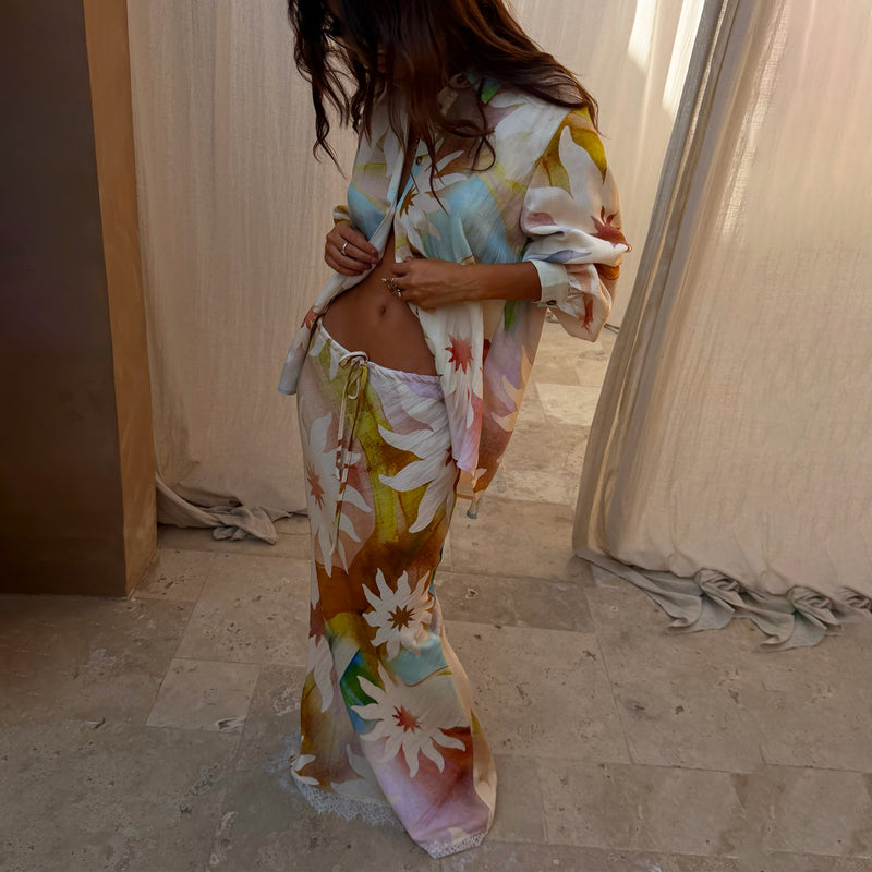 Abstract Soleil Mabel Skirt with sun motifs, a drawstring waist and lace hem detailing, paired with a matching shirt.