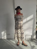 Model wearing Mono Palm Jasmine Dress standing facing the camera 