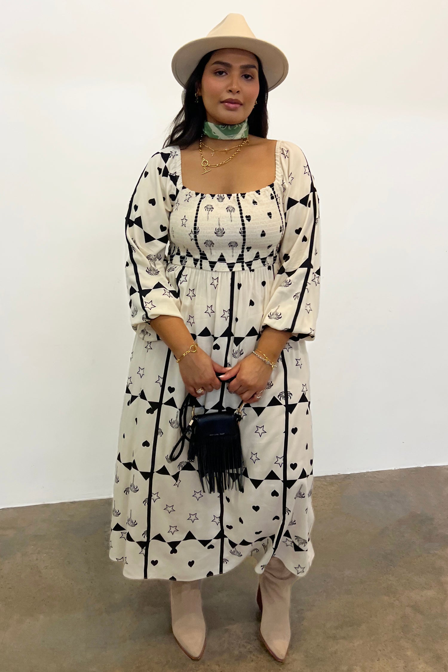 Model wearing Mono Palm Jasmine Dress standing facing the camera 