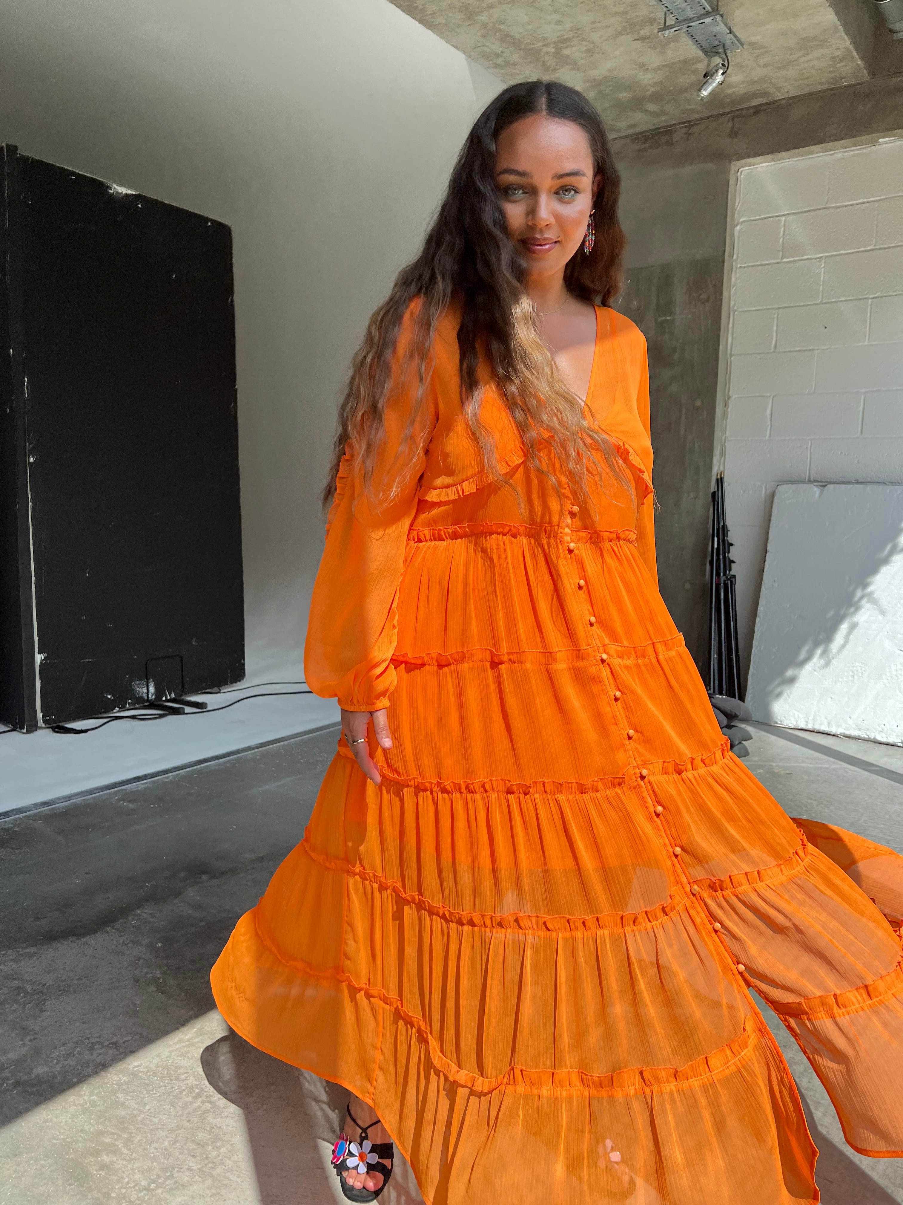 Model wearing Orange Clemmie Dress