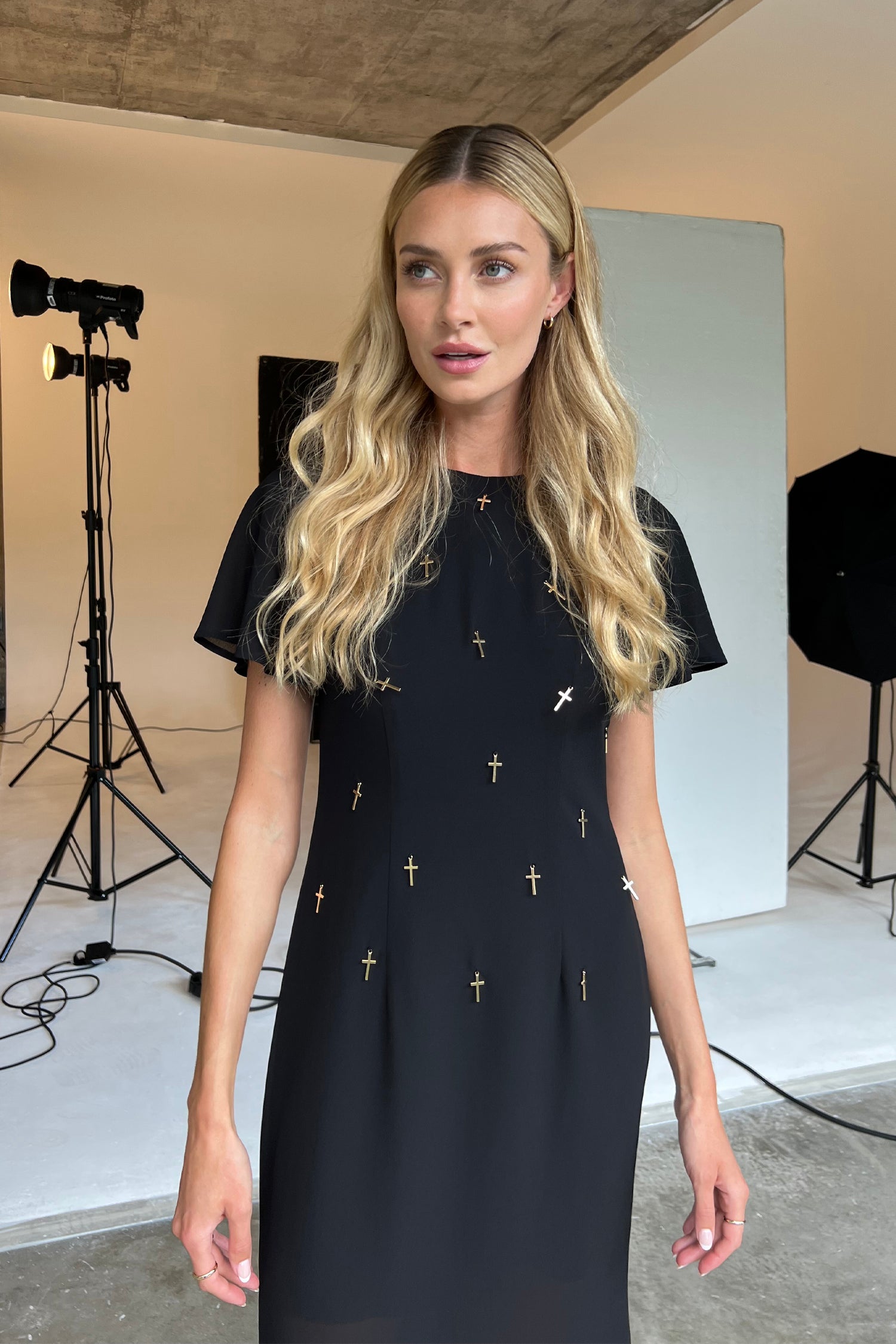 Model wearing Black Leah Dress standing facing the camera