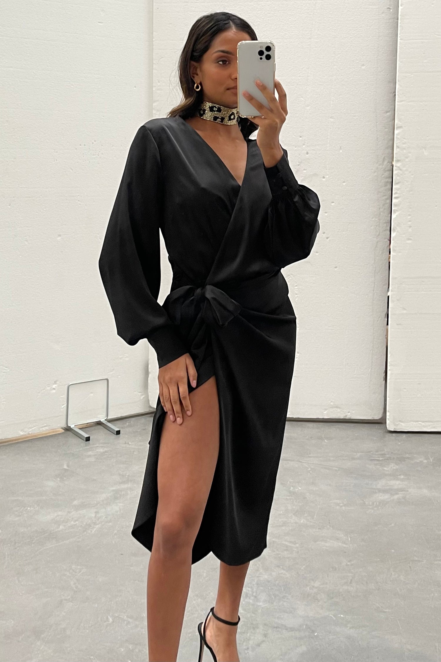 Model wearing Black Midi Vienna Dress standing facing the camera