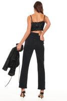 Thumbnail for Model wearing Black Sparkle Crop Top standing facing away from the camera 