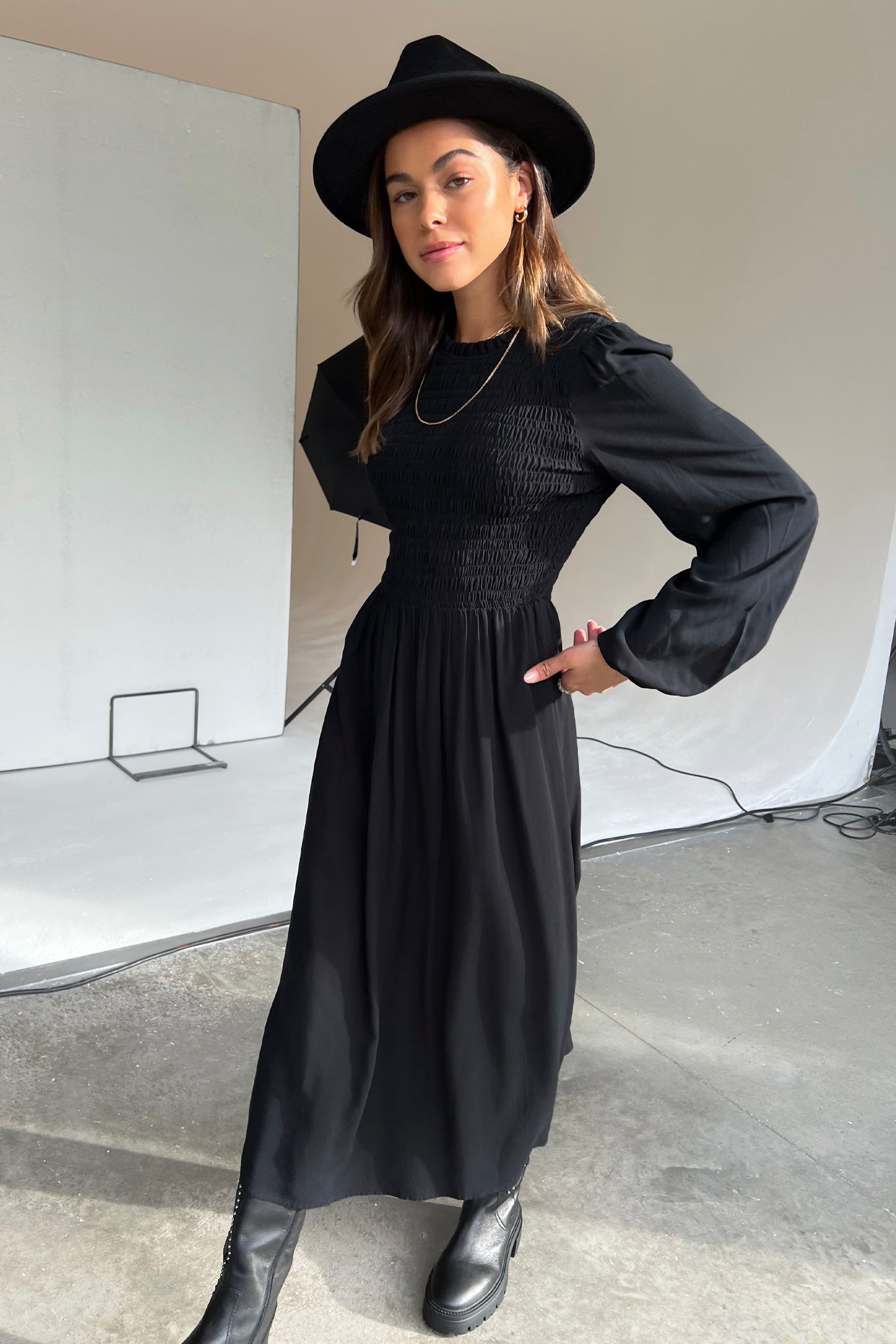 Model wearing Black Swedish Dress standing facing the camera