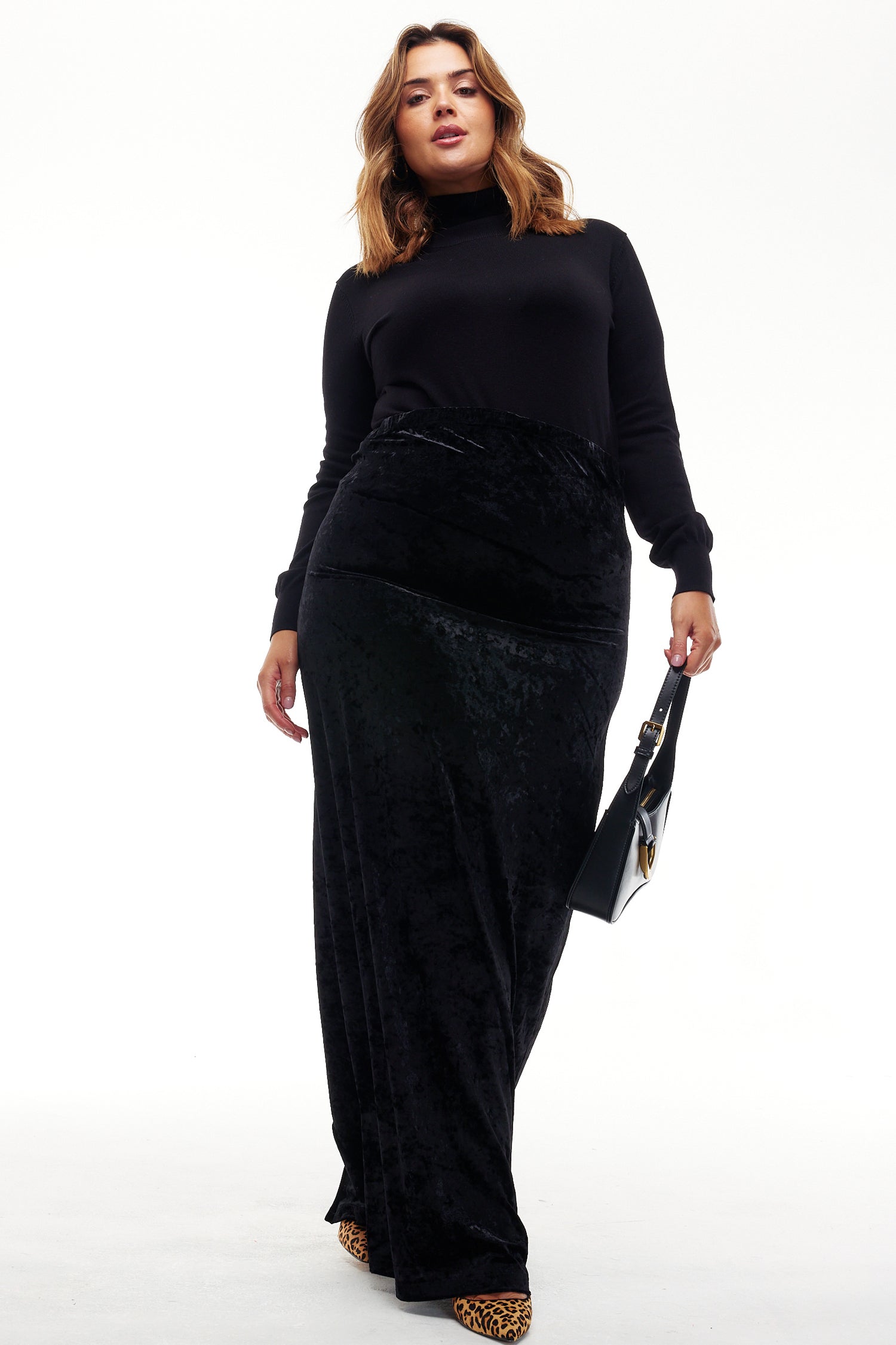 Model wearing Black Velvet Maxi Dress standing facing the camera