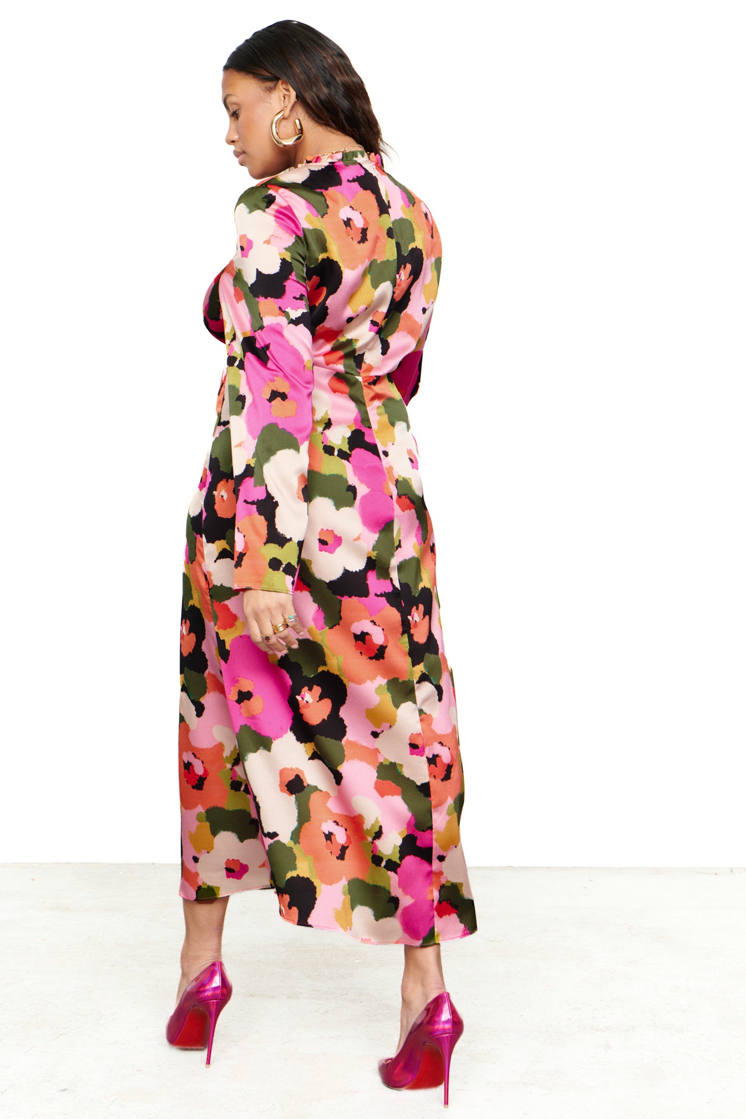 Model wearing Winter Blossom Beau Dress standing facing away from the camera