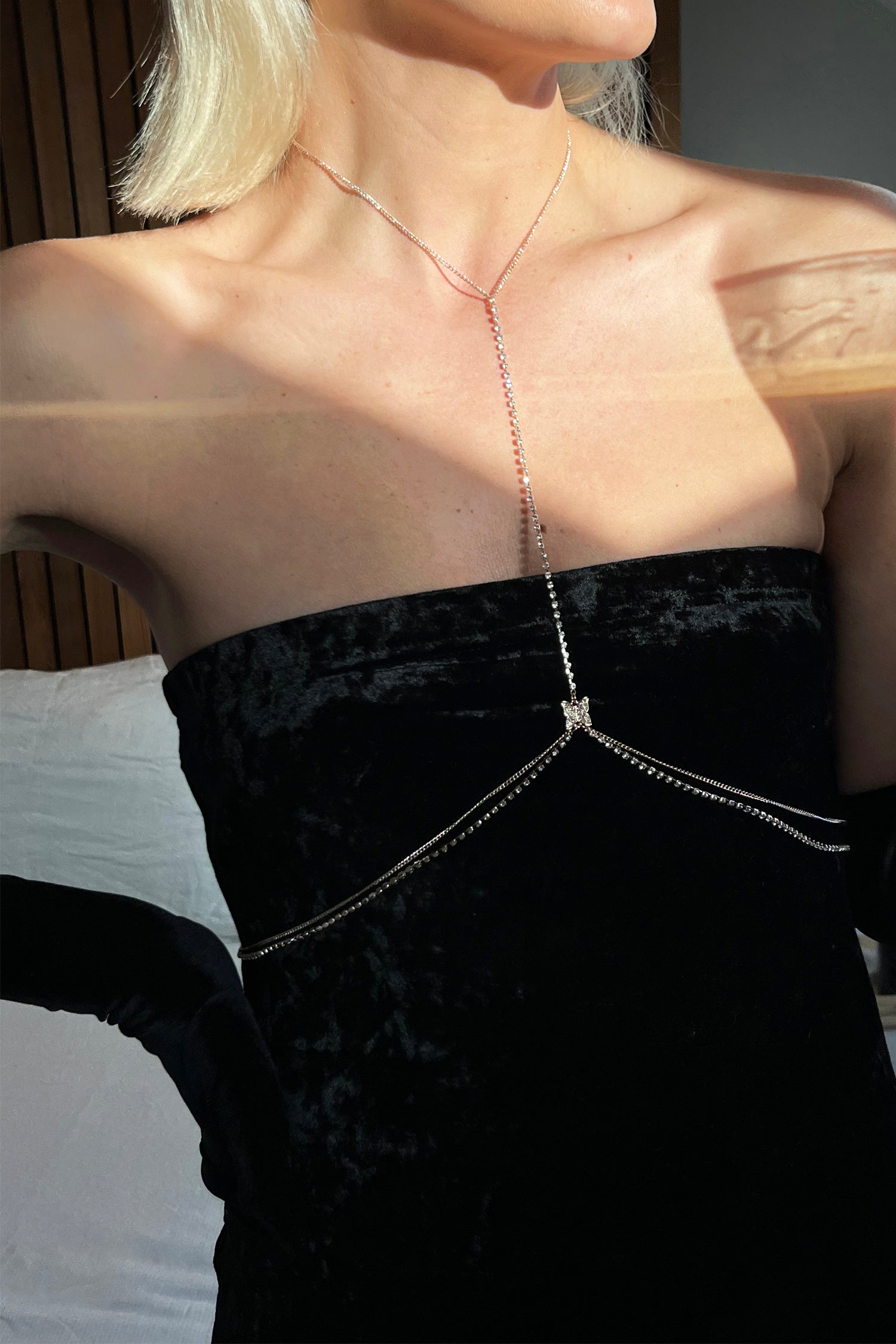 Model wearing Butterfly Body Chain standing facing the camera 