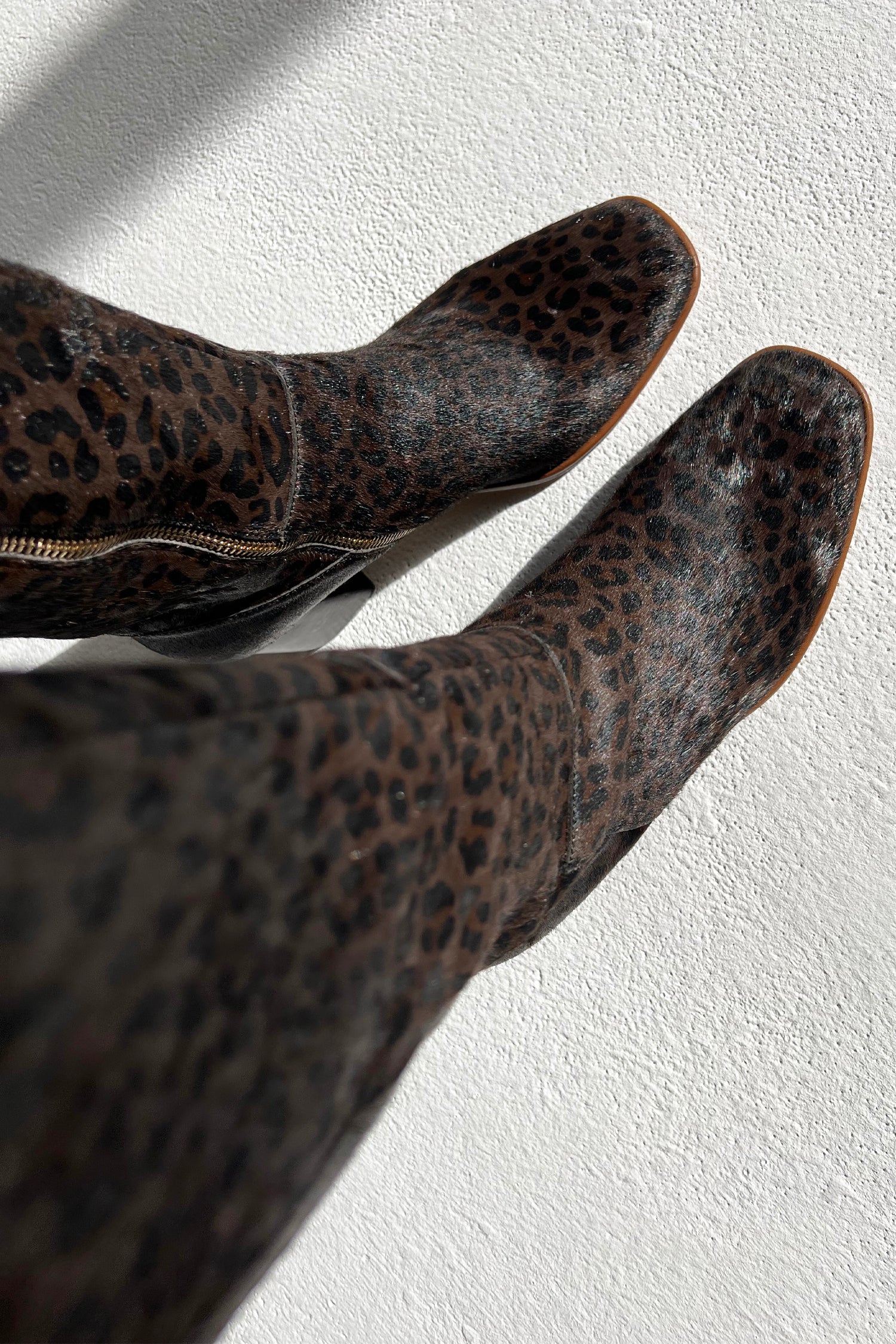 Model wearing Chocolate Leopard Long Boot standing facing the camera close up