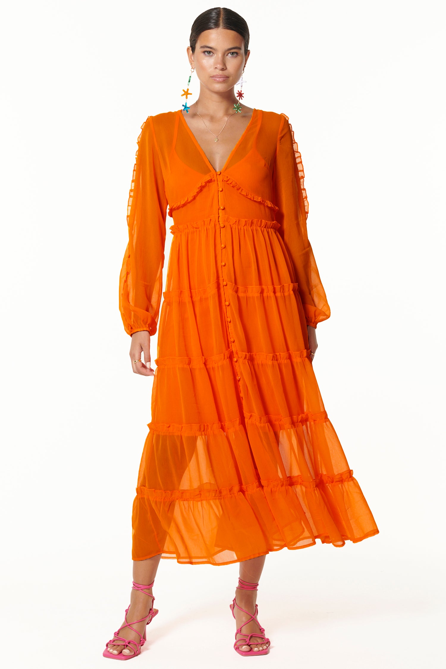 Model wearing Orange Clemmie Dress facing the camera