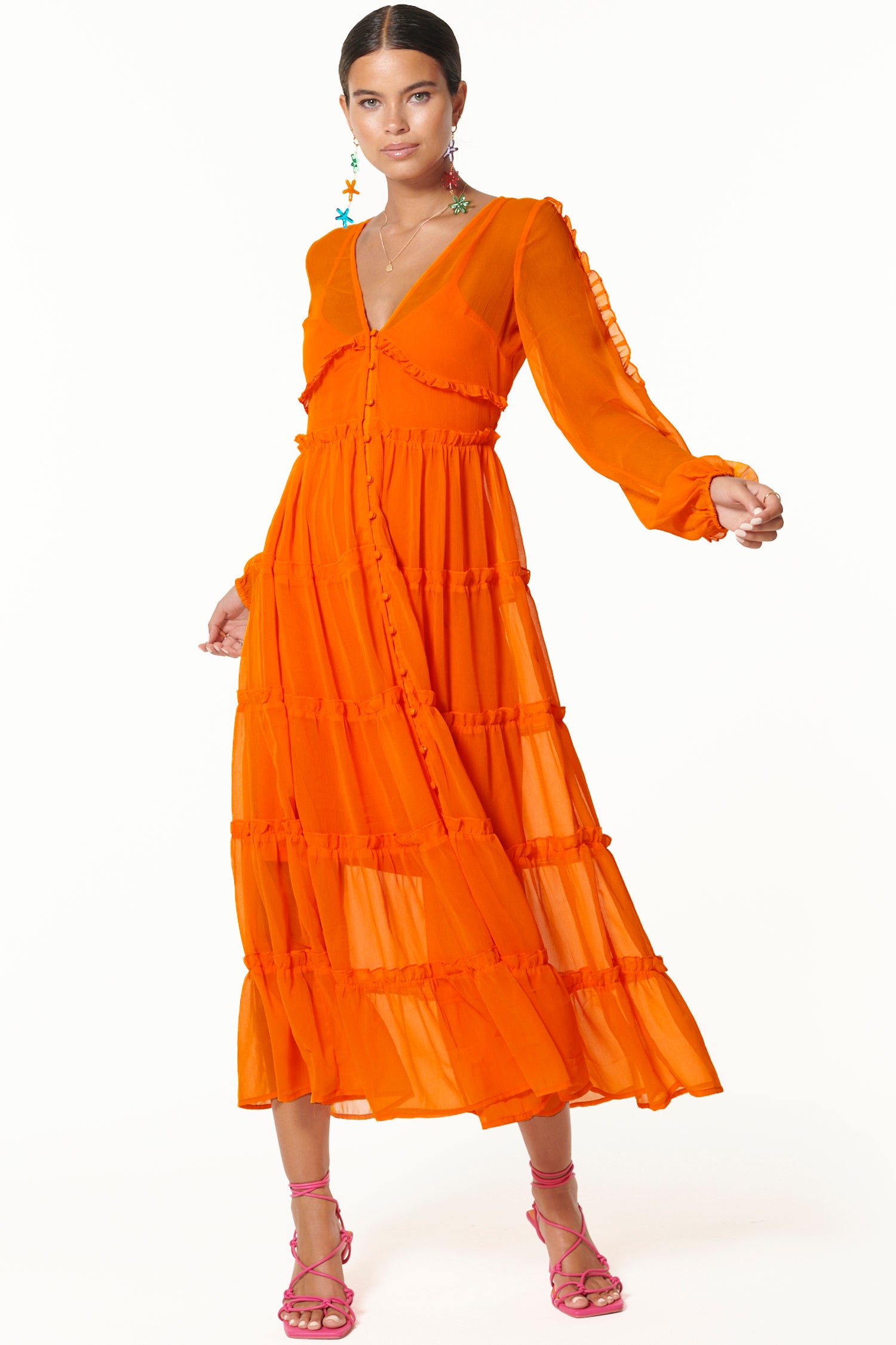 Model wearing Orange Clemmie Dress facing the camera