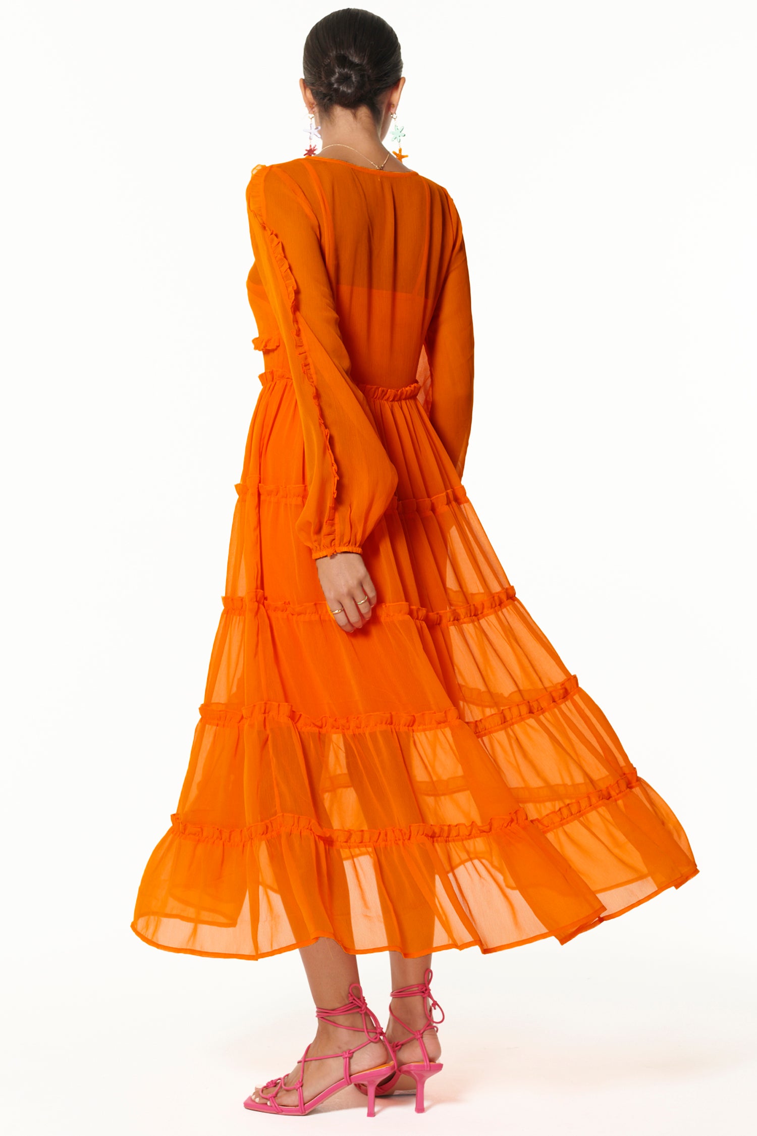 Model wearing Orange Clemmie Dress back shot