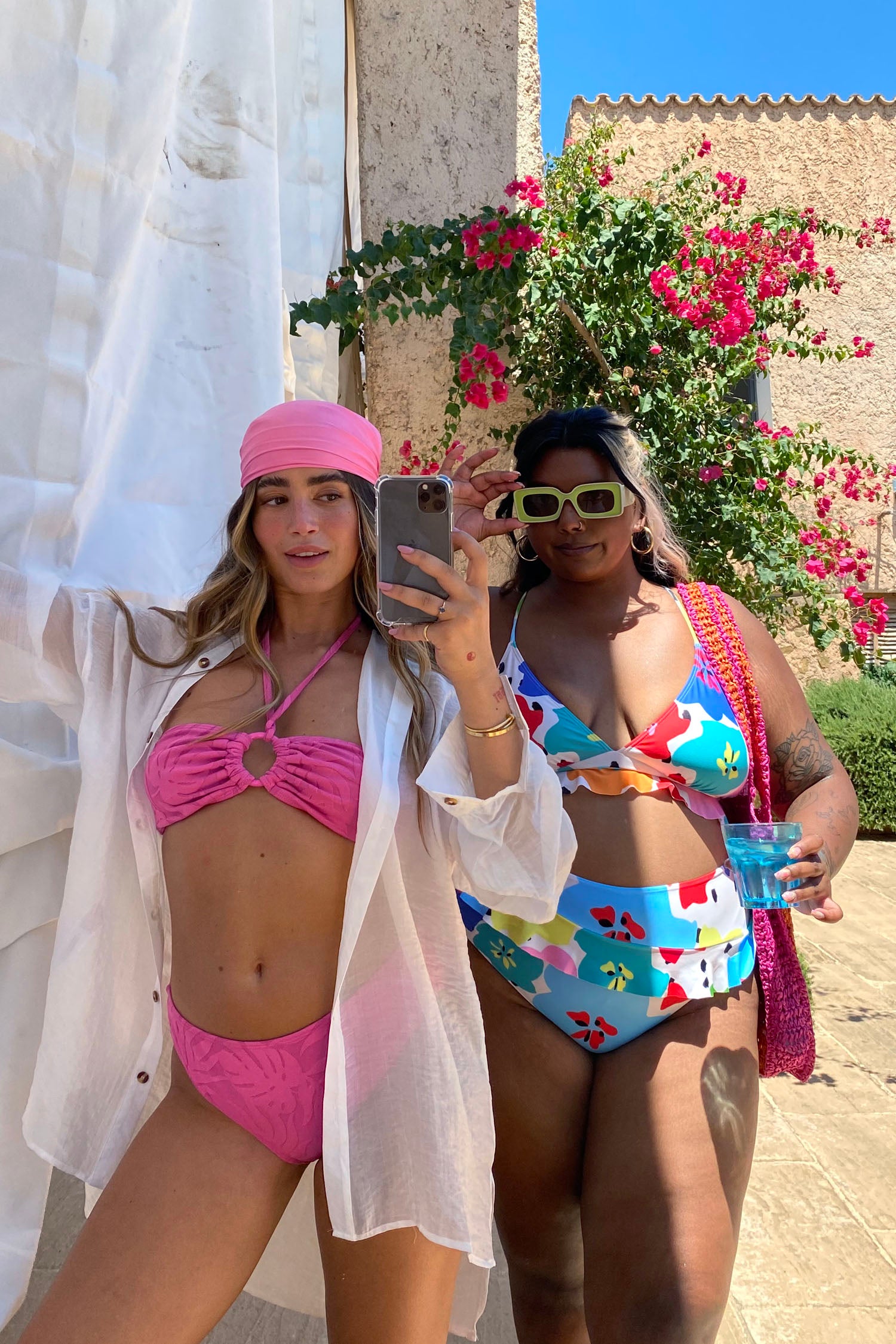 Model wearing Pink Palm Bikini Top facing the camera