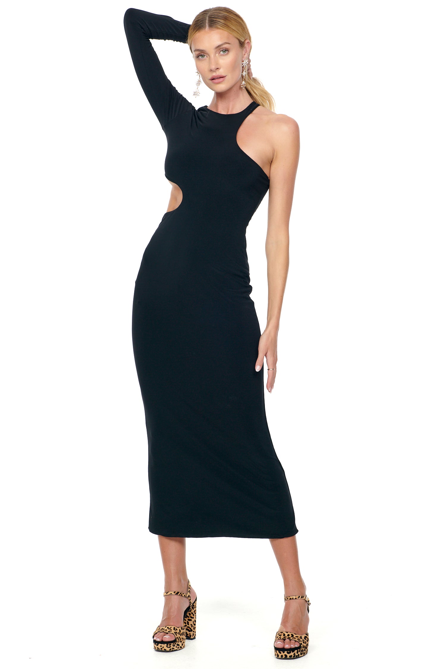 Model wearing Black Midi Gigi Cut Out Dress standing facing the camera