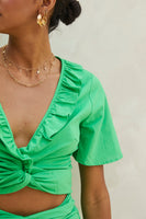 Thumbnail for Model wearing Green Cotton Linen Roma Top standing facing the camera close up