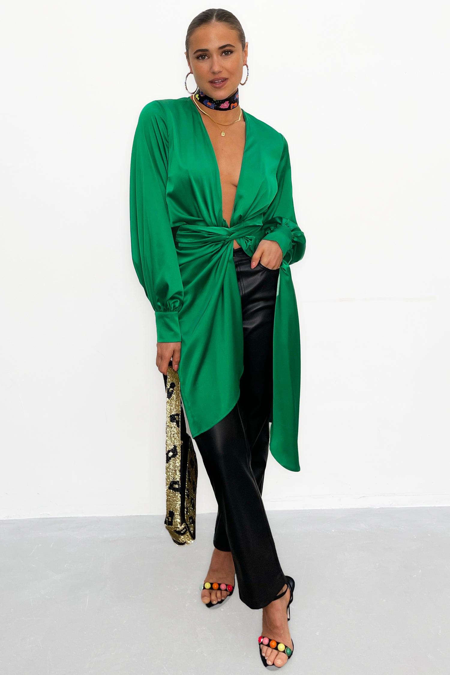 Model wearing Green Vienna Midi Dress standing facing the camera