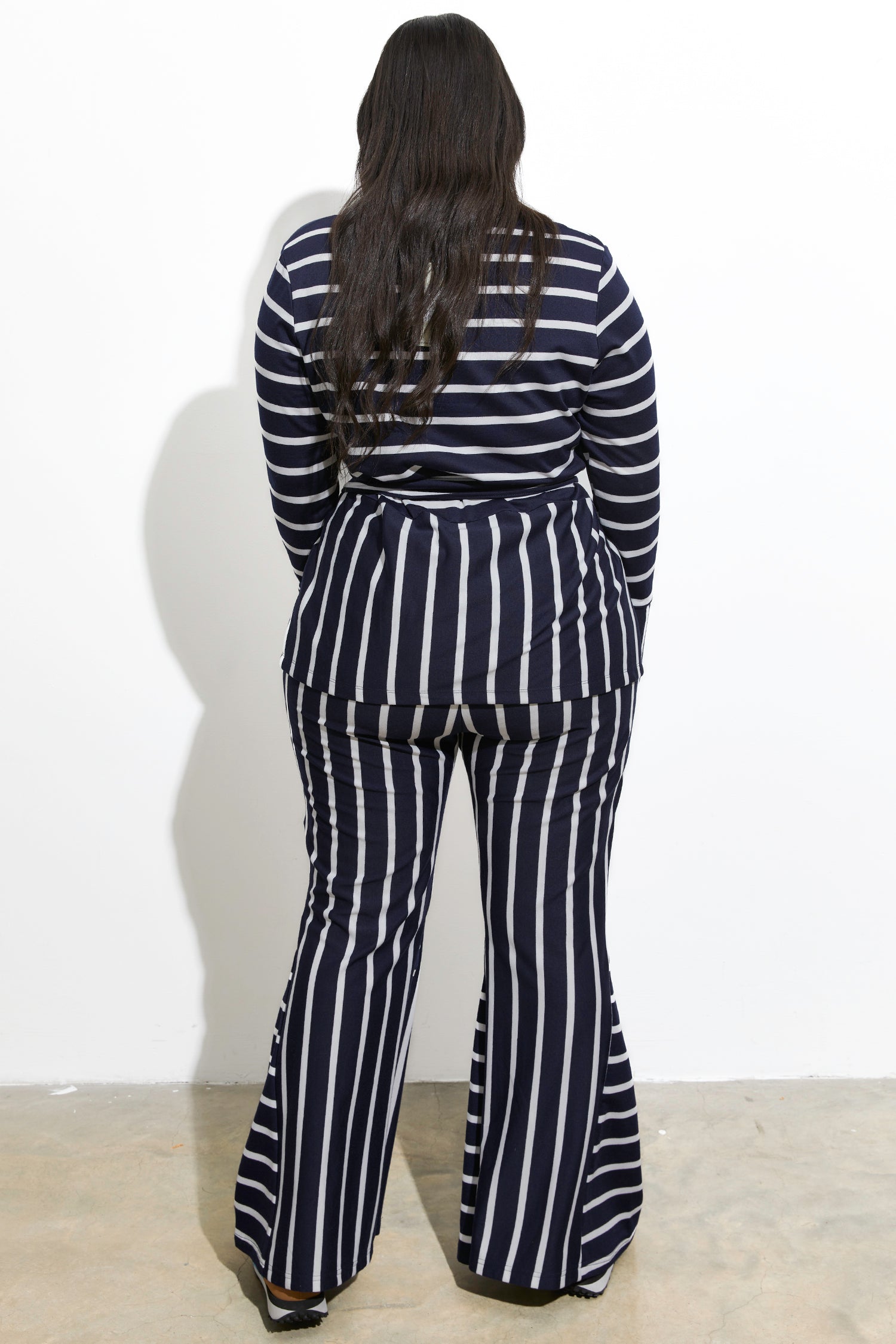 Model wearing Navy Nautical Jersey Trousers standing facing away from the camera
