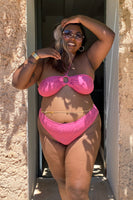 Thumbnail for Model wearing Pink Palm Bikini Top standing facing the camera