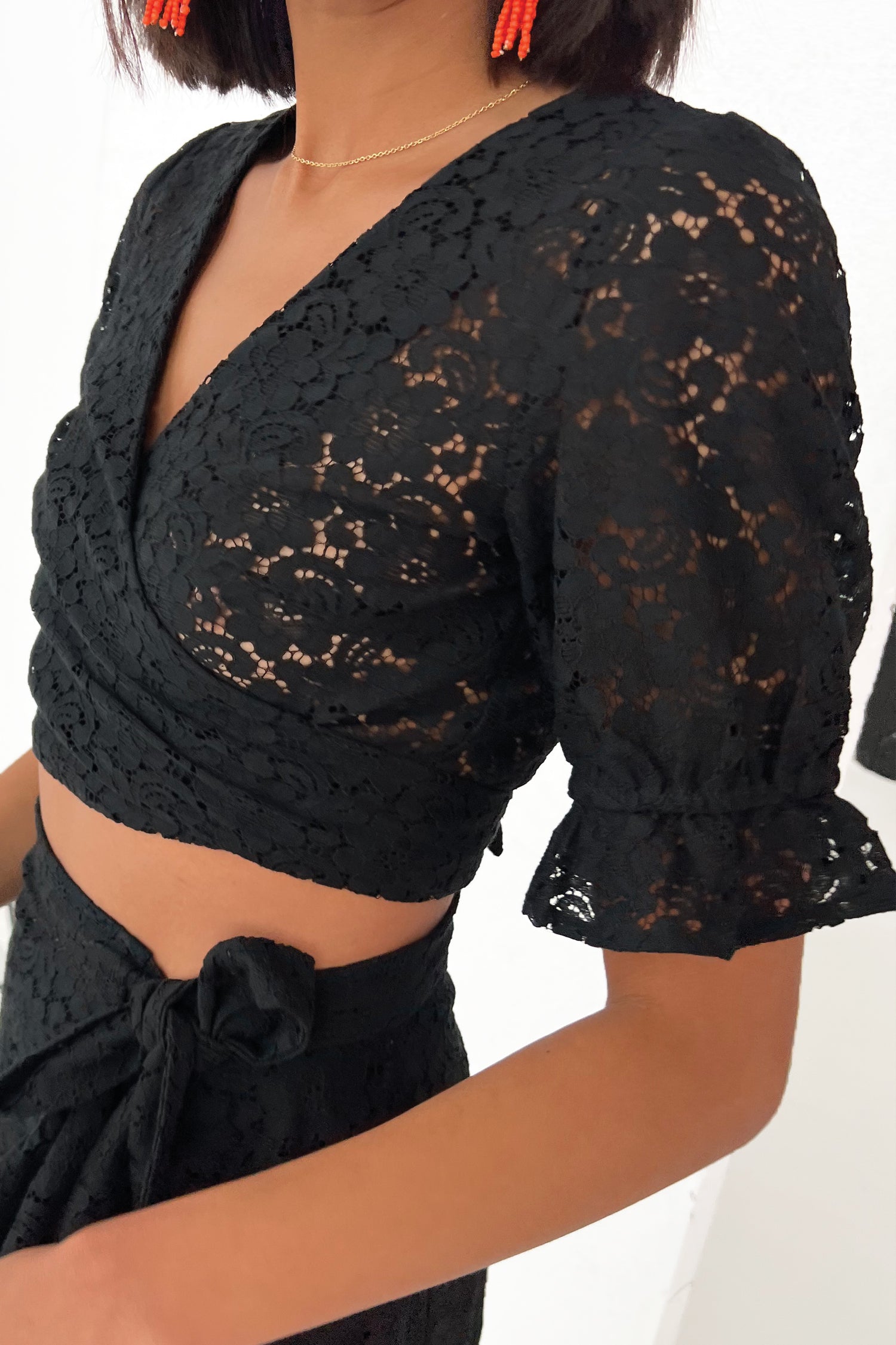 Model wearing Black Lace River Top close up