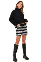 Thumbnail for Model wearing Sylvie Mini Knit Skirt standing facing the camera