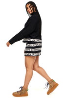 Thumbnail for Model wearing Sylvie Mini Knit Skirt standing facing away from the camera