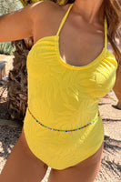 Thumbnail for Model wearing Yellow Palm Swimsuit standing facing the camera close up