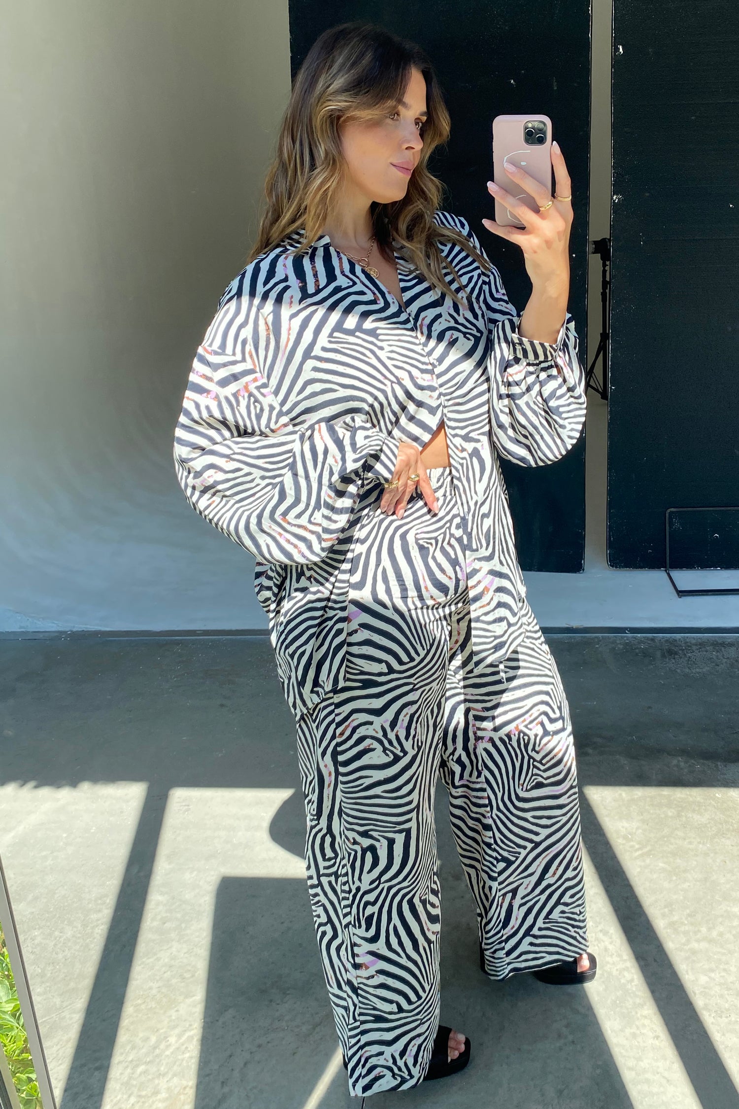 Model wearing Zebra Trousers standing facing the camera
