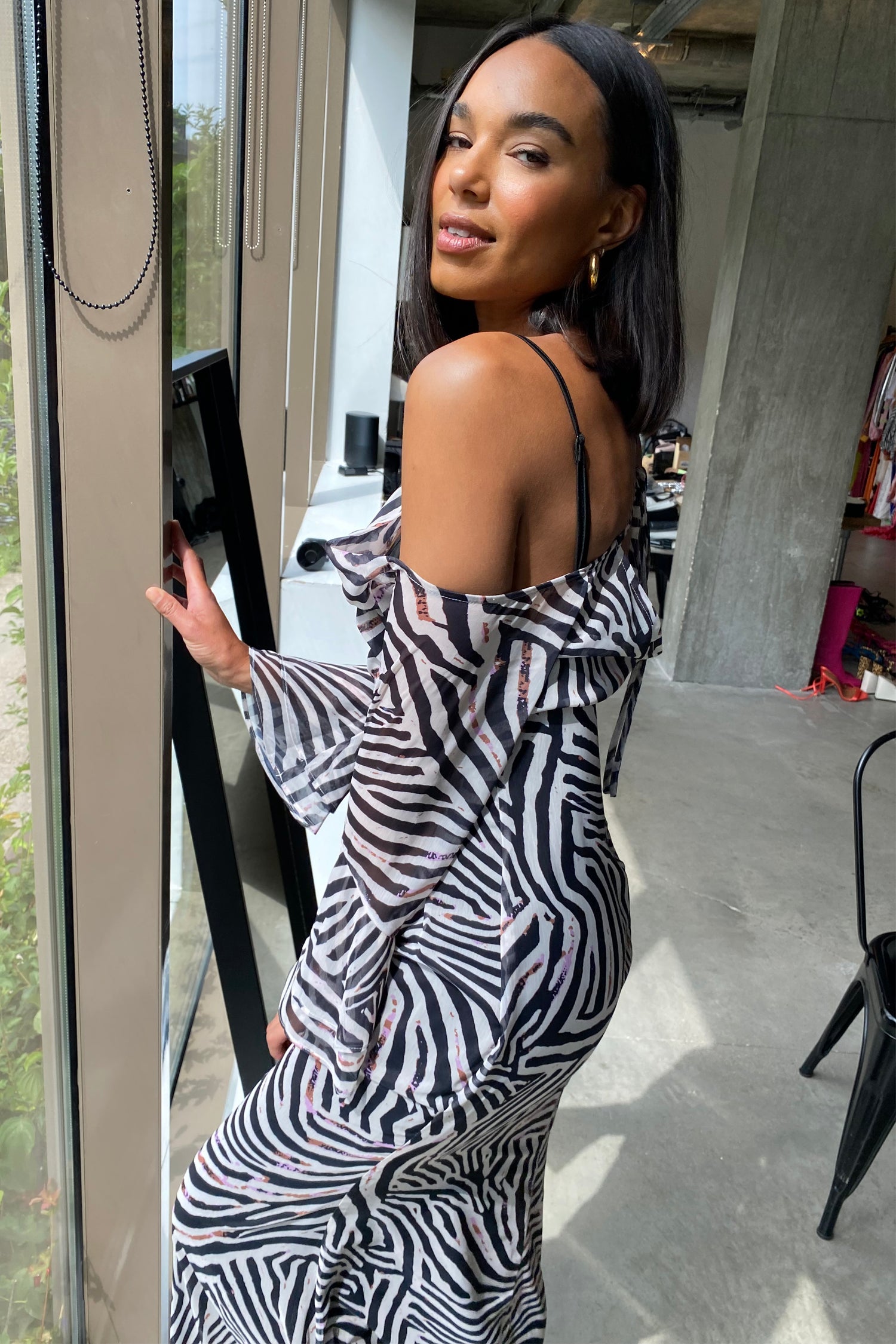 Model wearing Zebra Ophelia Dress standing facing away from camera close up